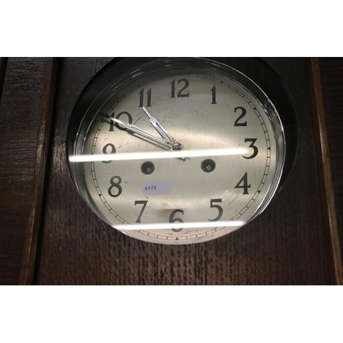 524 - 1930's Oak Cased Wall Clock, the silvered dial with Arabic numerals, 77cm high