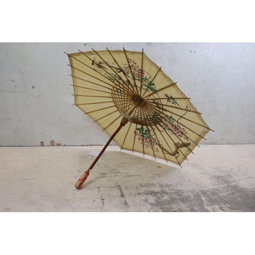 375 - Oriental Paper Parasol together with Early 20th century Cream Parasol with horn handle