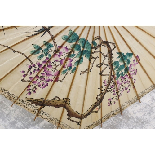 375 - Oriental Paper Parasol together with Early 20th century Cream Parasol with horn handle