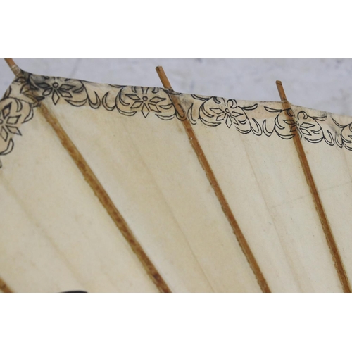 375 - Oriental Paper Parasol together with Early 20th century Cream Parasol with horn handle