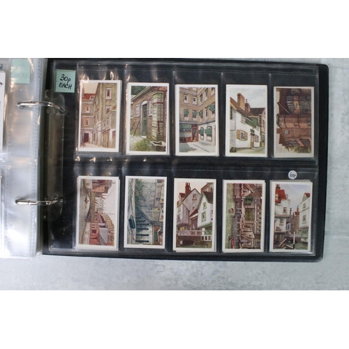 411 - A large collection of cigarette cards contained within twelve albums, full sets and part sets, date ... 