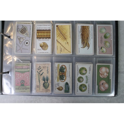 411 - A large collection of cigarette cards contained within twelve albums, full sets and part sets, date ... 