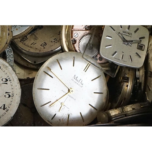 297 - Watchmakers and repairers parts, to include movements, dials, various spares featuring winders, pock... 