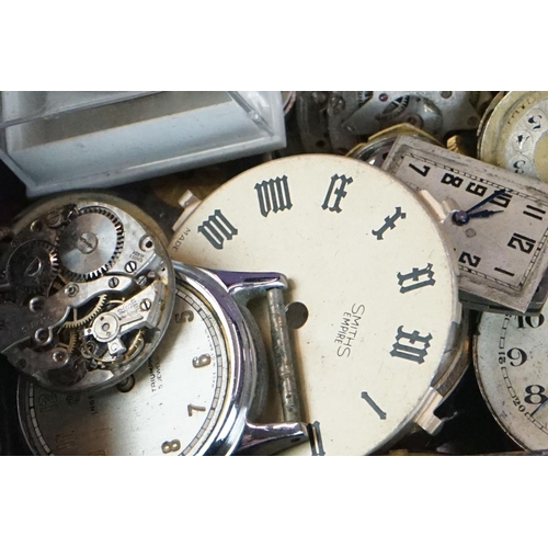 297 - Watchmakers and repairers parts, to include movements, dials, various spares featuring winders, pock... 