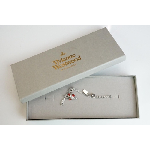 335 - A collection of Vivienne Westwood Jewellery to include Brooches and Necklaces contained within origi... 