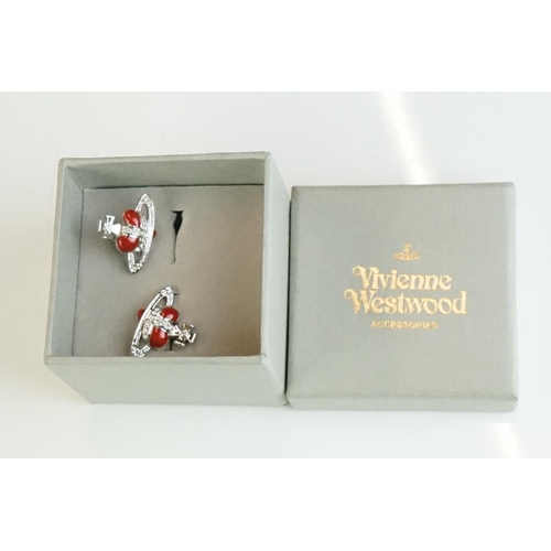 335 - A collection of Vivienne Westwood Jewellery to include Brooches and Necklaces contained within origi... 