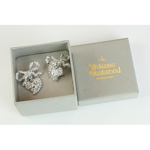 335 - A collection of Vivienne Westwood Jewellery to include Brooches and Necklaces contained within origi... 