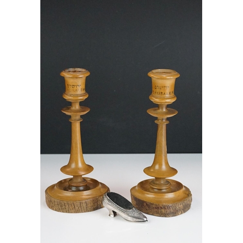 338 - A pair of turned olive wood candlesticks from Jerusalem together with a pin cushion in the form of a... 