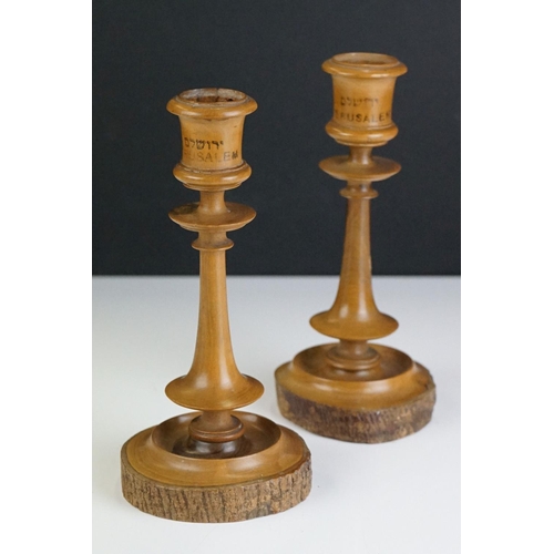 338 - A pair of turned olive wood candlesticks from Jerusalem together with a pin cushion in the form of a... 