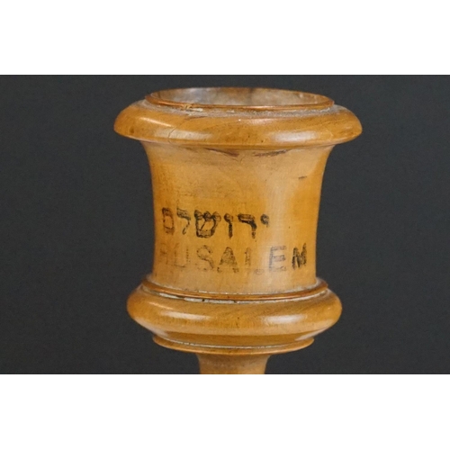 338 - A pair of turned olive wood candlesticks from Jerusalem together with a pin cushion in the form of a... 