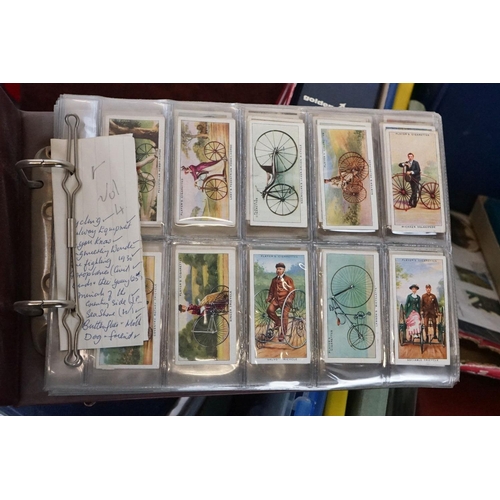 445 - A large collection of stamps, coins, cigarette cards, tea cards and first day covers contained in tw... 