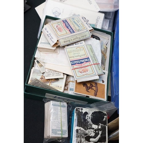 445 - A large collection of stamps, coins, cigarette cards, tea cards and first day covers contained in tw... 