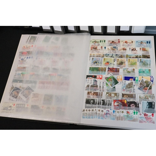 448 - A large collection of mainly British and commonwealth stamps contained within over ten albums togeth... 