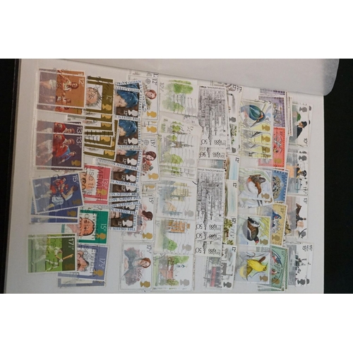 448 - A large collection of mainly British and commonwealth stamps contained within over ten albums togeth... 