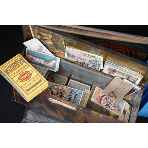 454 - A collection of mixed ephemera to include postcards, stamps and cigarette cards including a good qua... 