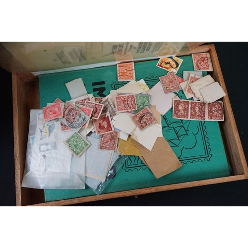 454 - A collection of mixed ephemera to include postcards, stamps and cigarette cards including a good qua... 