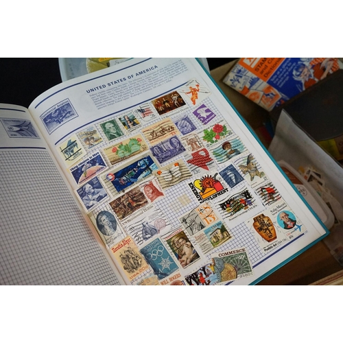 460 - A collection of British and world stamps within albums and loose examples together with stamp catalo... 