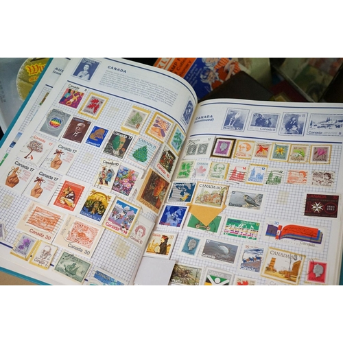 460 - A collection of British and world stamps within albums and loose examples together with stamp catalo... 