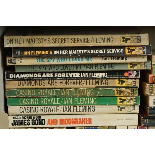 461 - A large collection of over forty Ian Fleming James Bond paperback books to include many Pan examples... 