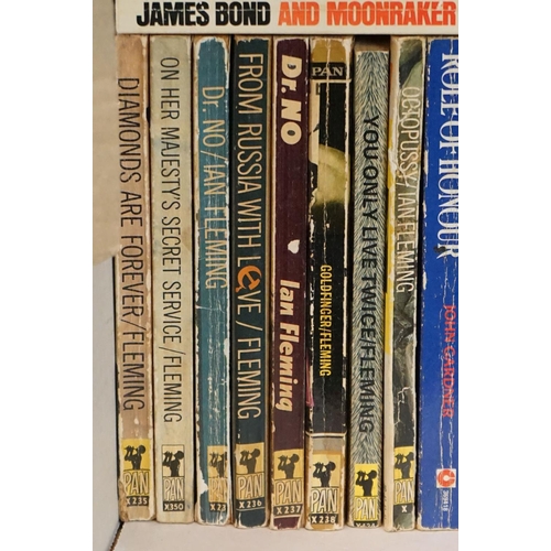 461 - A large collection of over forty Ian Fleming James Bond paperback books to include many Pan examples... 