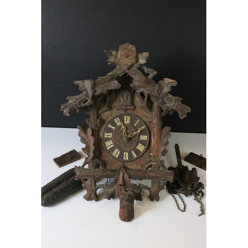 346 - A German Black Forest traditional cuckoo clock complete with weights.