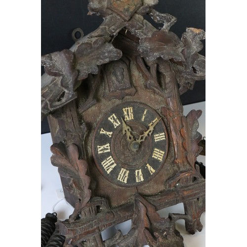 346 - A German Black Forest traditional cuckoo clock complete with weights.