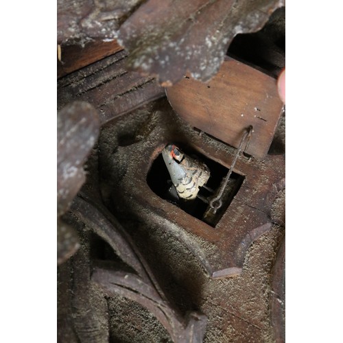 346 - A German Black Forest traditional cuckoo clock complete with weights.