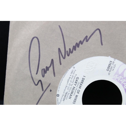 386 - Vinyl & Autographs – 2 Gary Numan singles signed by Gary Numan