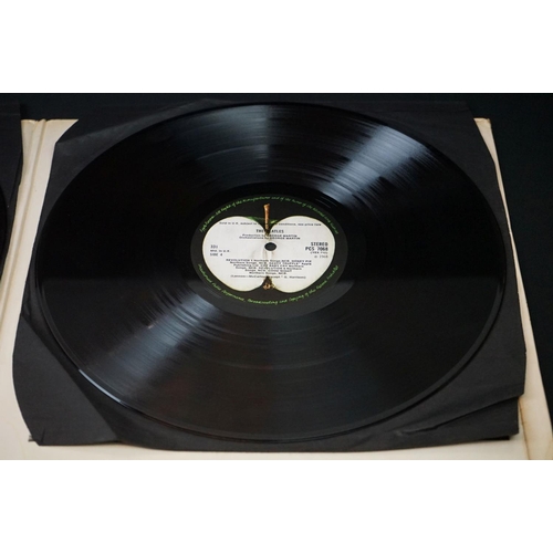 566 - Vinyl - 13 The Beatles and related LPs to include The White Album No.0527391 Stereo, top loader, wit... 