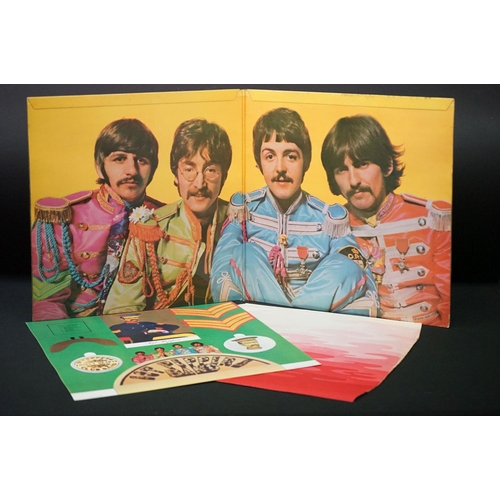 566 - Vinyl - 13 The Beatles and related LPs to include The White Album No.0527391 Stereo, top loader, wit... 