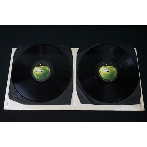 566 - Vinyl - 13 The Beatles and related LPs to include The White Album No.0527391 Stereo, top loader, wit... 