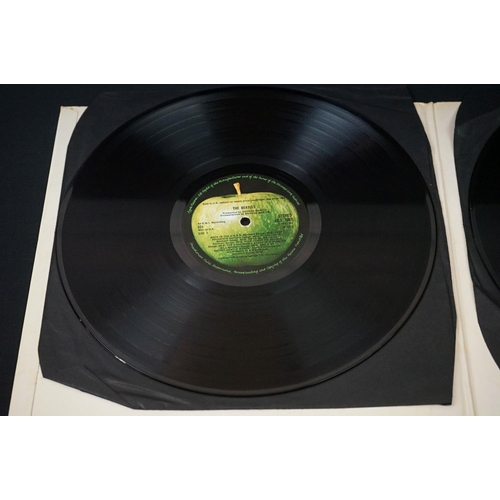 566 - Vinyl - 13 The Beatles and related LPs to include The White Album No.0527391 Stereo, top loader, wit... 