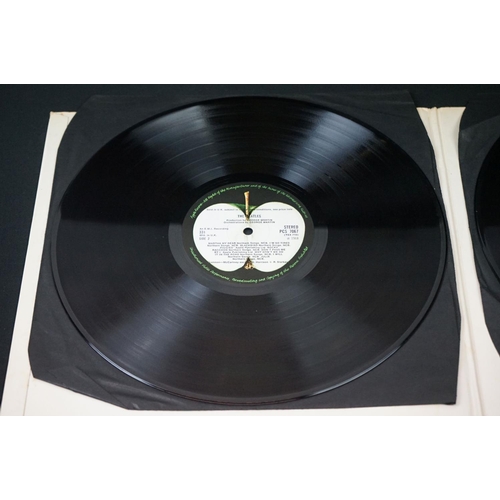 566 - Vinyl - 13 The Beatles and related LPs to include The White Album No.0527391 Stereo, top loader, wit... 