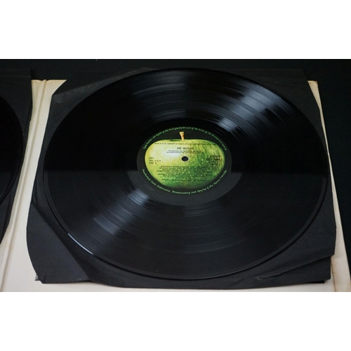 566 - Vinyl - 13 The Beatles and related LPs to include The White Album No.0527391 Stereo, top loader, wit... 