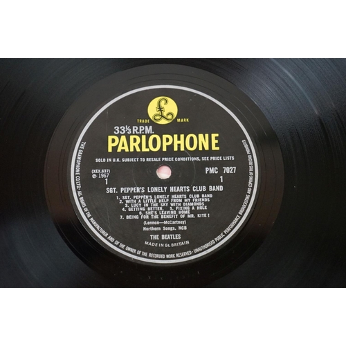 566 - Vinyl - 13 The Beatles and related LPs to include The White Album No.0527391 Stereo, top loader, wit... 