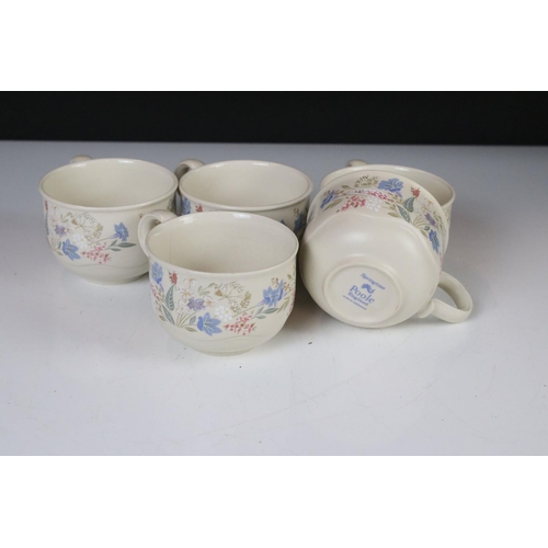 59 - Poole Pottery ' Springtime ' ware comprising 5 Tea Cups, 9 saucers, 5 tea plates, 9 breakfast plates... 