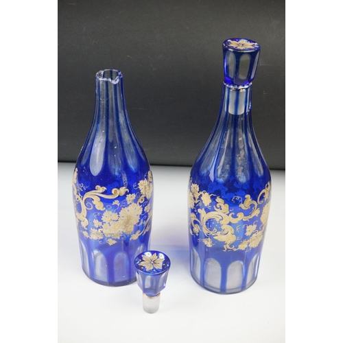 11 - Glass Blue Flash Cut Decanter and Stopper, 37cm high together with a Pair of Blue Flash Cut Decanter... 