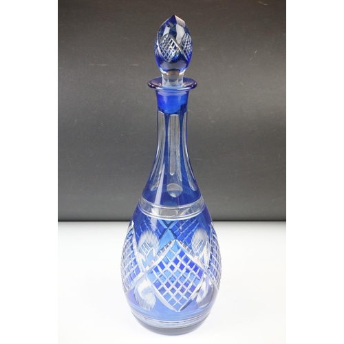 11 - Glass Blue Flash Cut Decanter and Stopper, 37cm high together with a Pair of Blue Flash Cut Decanter... 