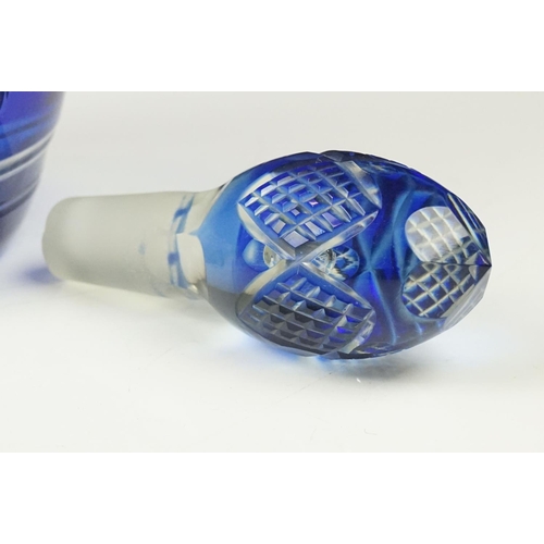 11 - Glass Blue Flash Cut Decanter and Stopper, 37cm high together with a Pair of Blue Flash Cut Decanter... 