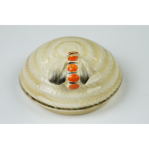 4 - Clarice Cliff Pottery Beehive Honey Pot in the Radiance pattern (damage to wing of bee), 11cm high