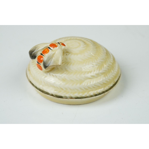 4 - Clarice Cliff Pottery Beehive Honey Pot in the Radiance pattern (damage to wing of bee), 11cm high