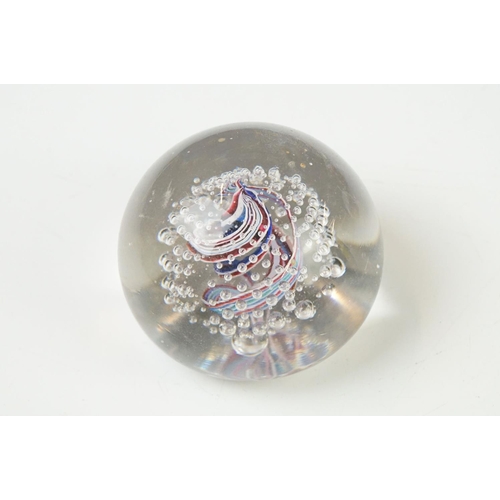 36 - Seven Glass Paperweights including Mats Jonasson ' Seal ', Caithness ' Pink Champagne ', two Bubble ... 