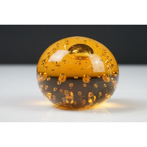 36 - Seven Glass Paperweights including Mats Jonasson ' Seal ', Caithness ' Pink Champagne ', two Bubble ... 