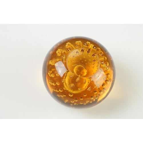 36 - Seven Glass Paperweights including Mats Jonasson ' Seal ', Caithness ' Pink Champagne ', two Bubble ... 