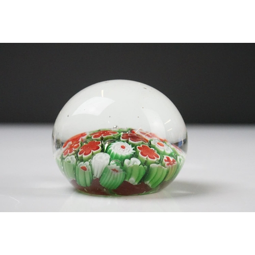 36 - Seven Glass Paperweights including Mats Jonasson ' Seal ', Caithness ' Pink Champagne ', two Bubble ... 