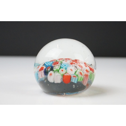 36 - Seven Glass Paperweights including Mats Jonasson ' Seal ', Caithness ' Pink Champagne ', two Bubble ... 