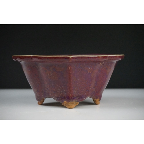 46 - Chinese Jun type Quatrefoil Planter and Stand, the exterior with a purple tone glaze and the interio... 