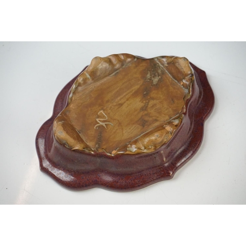 46 - Chinese Jun type Quatrefoil Planter and Stand, the exterior with a purple tone glaze and the interio... 