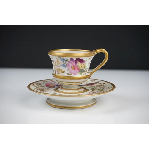 53 - Pair of Continental Porcelain Cabinet Cups and Saucers decorated in gilt and enamels with flowers an... 