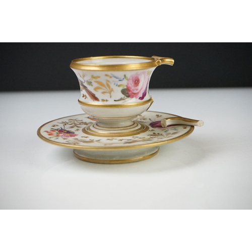 53 - Pair of Continental Porcelain Cabinet Cups and Saucers decorated in gilt and enamels with flowers an... 